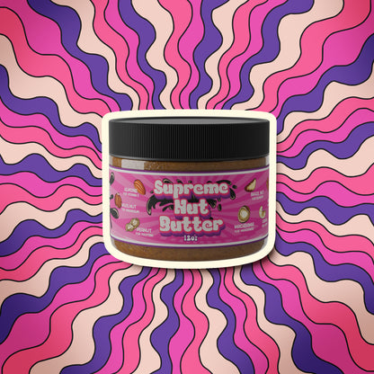 Better Than Honey Supreme Nut Butter jar with purple wave background – blend of nine nuts and molasses for protein and minerals.